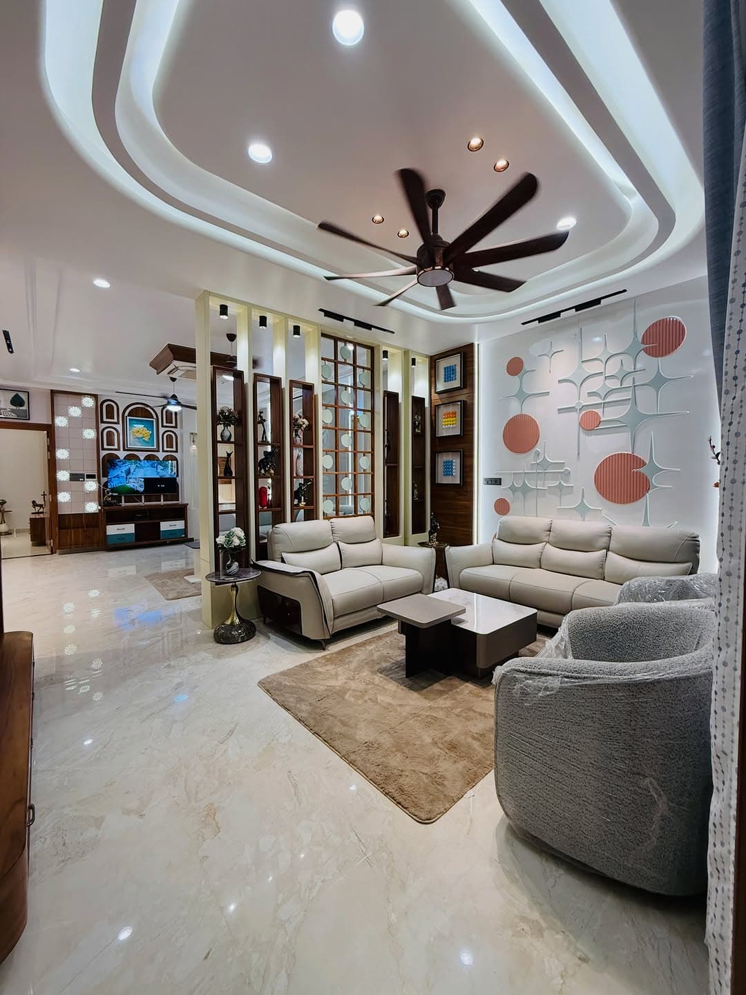 Living room with wooden TV console and display unit
